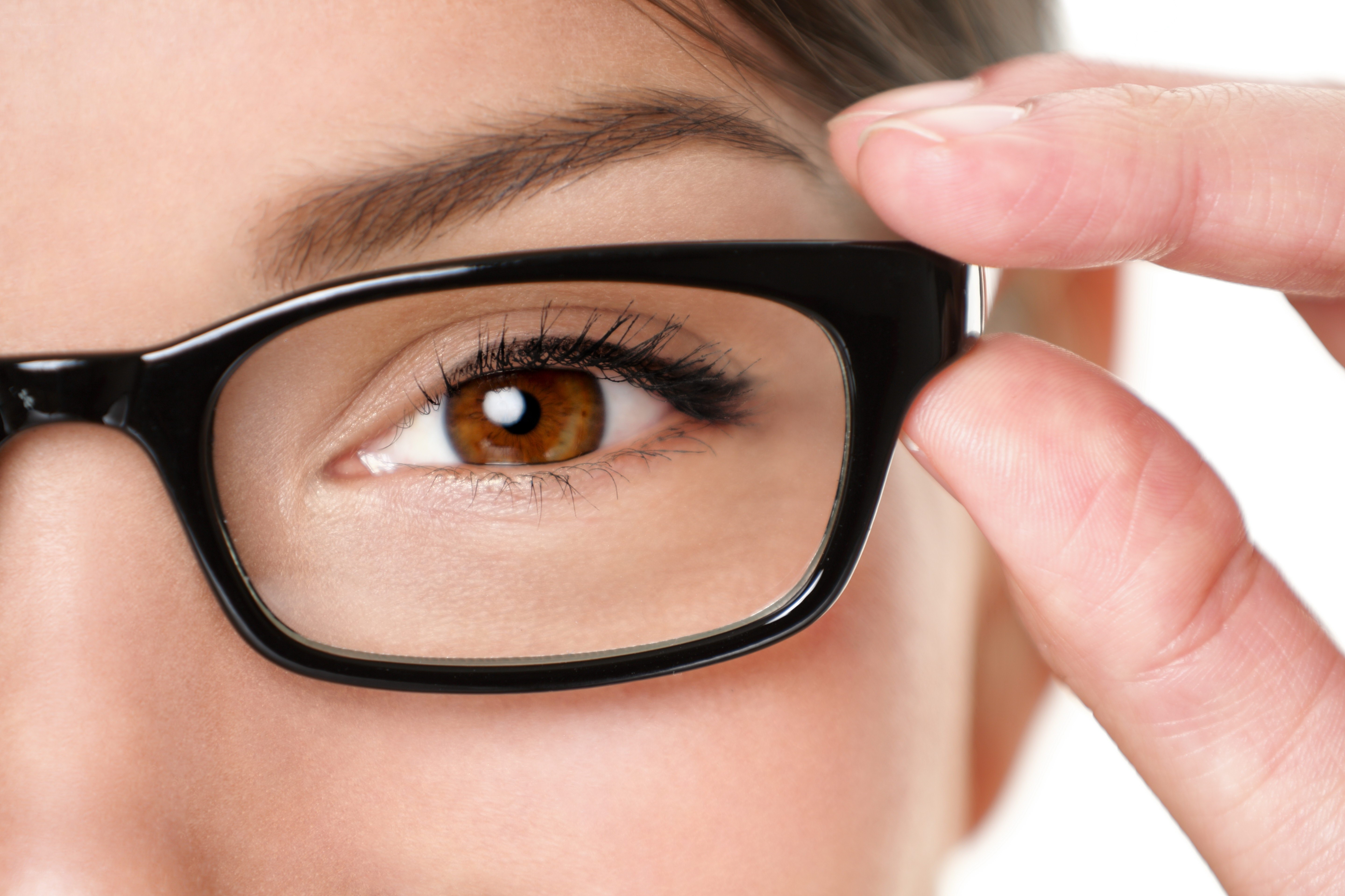 woman adjusting glasses