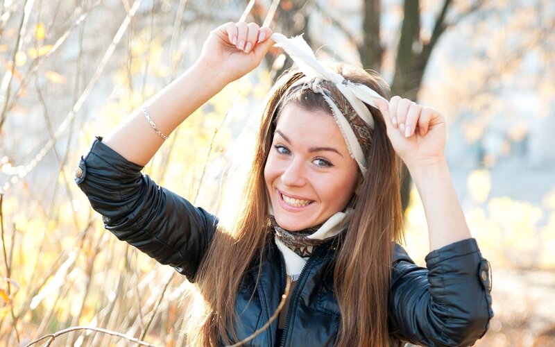 woman adjusting headband outdoors