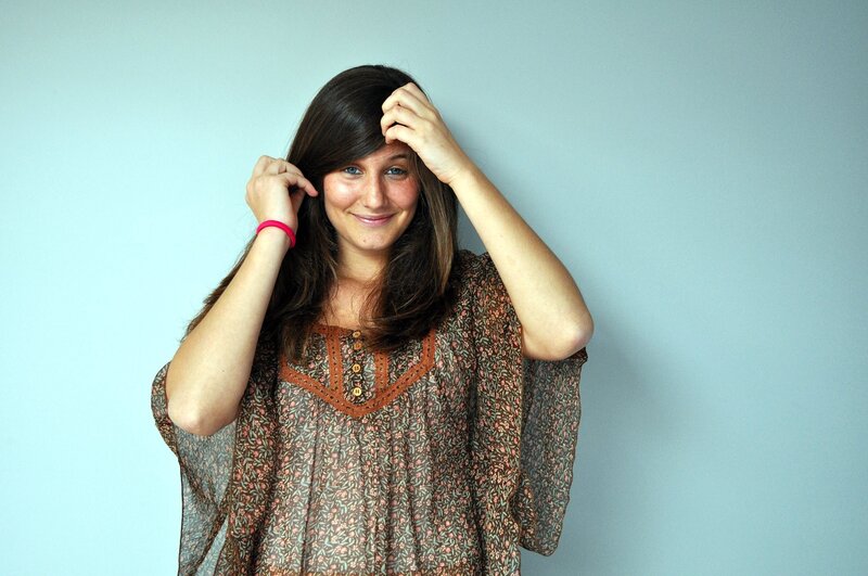 woman adjusting her hair