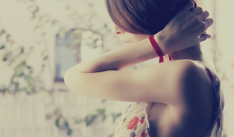 woman adjusting her hair
