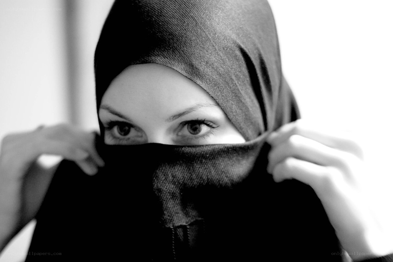 woman adjusting hijab
