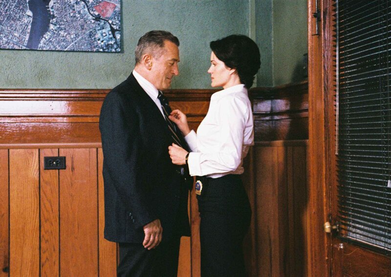 Woman Adjusting Man's Tie