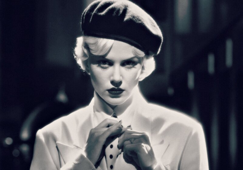 Woman Adjusting Tie