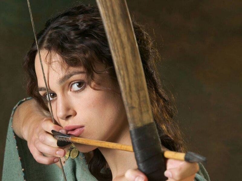woman aiming a bow and arrow