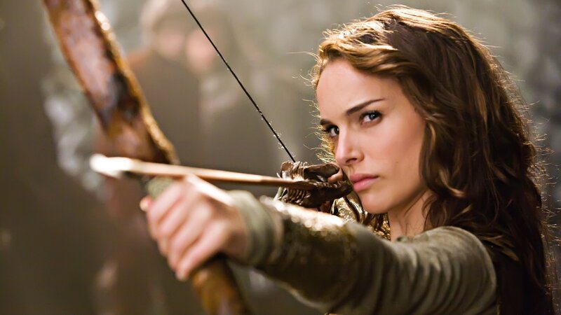 woman aiming a bow and arrow