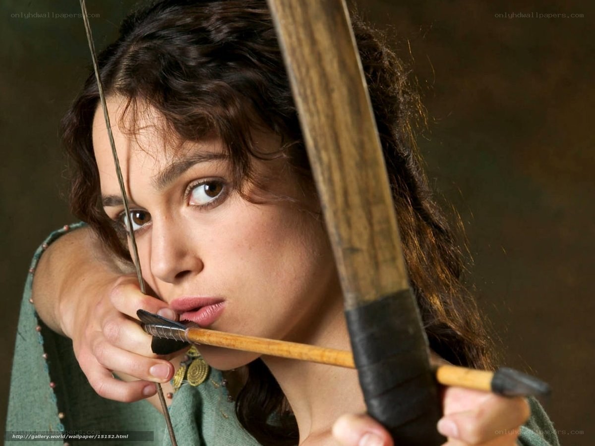 woman aiming a bow and arrow