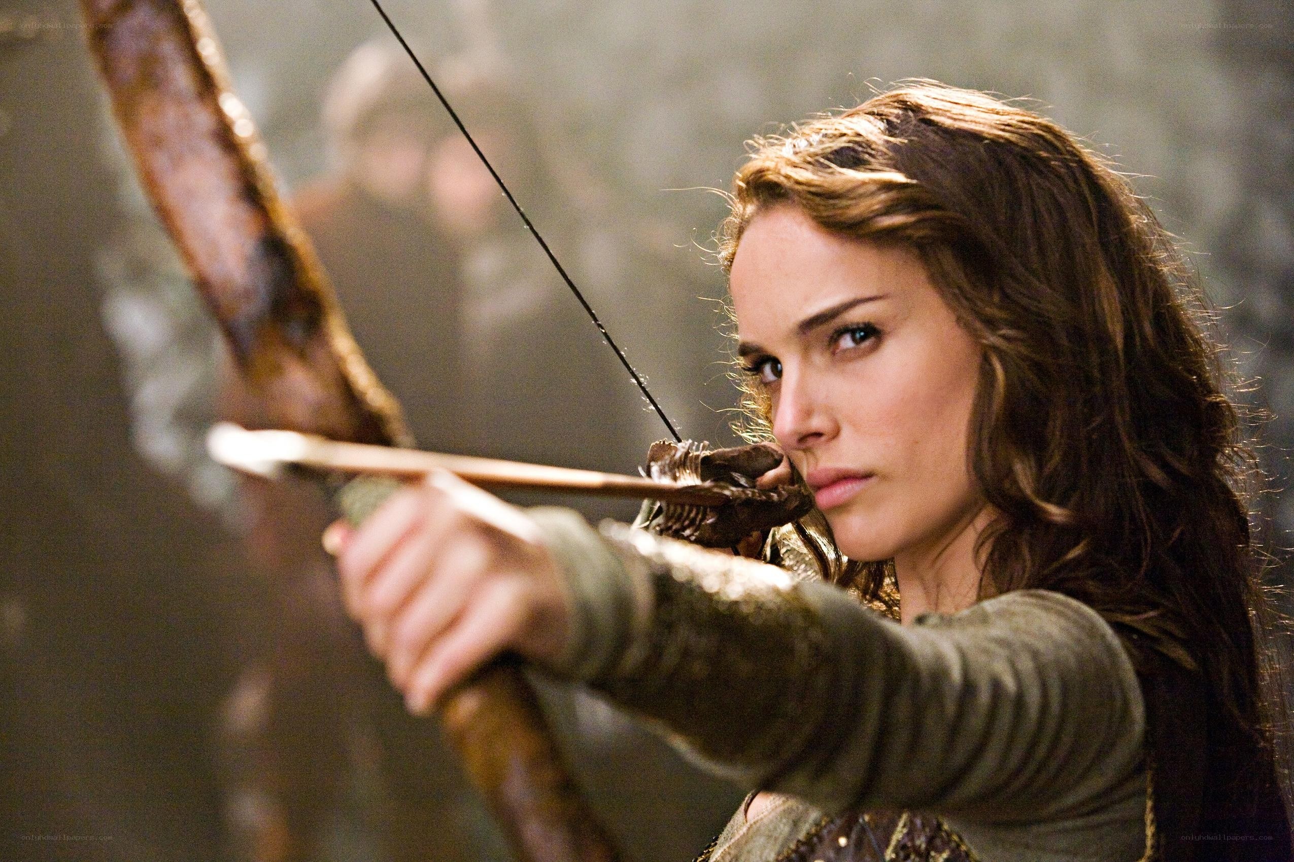 woman aiming a bow