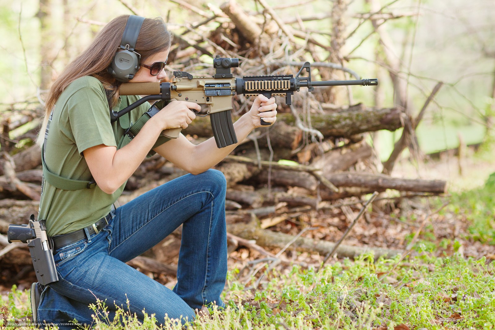 woman aiming rifle at range