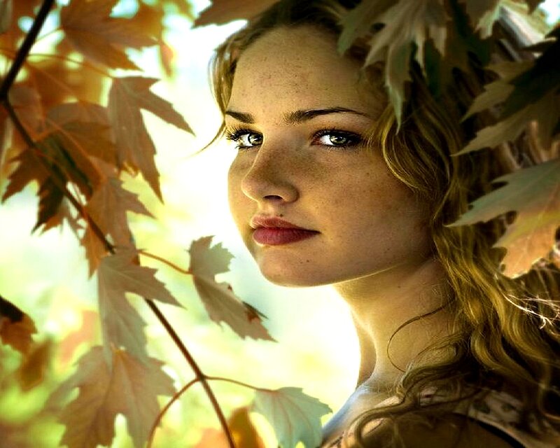 woman among autumn leaves