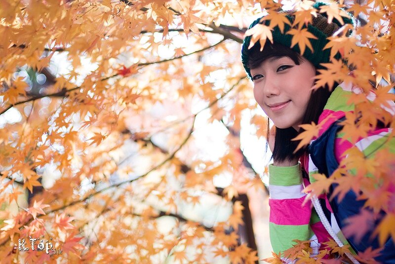 woman among autumn leaves