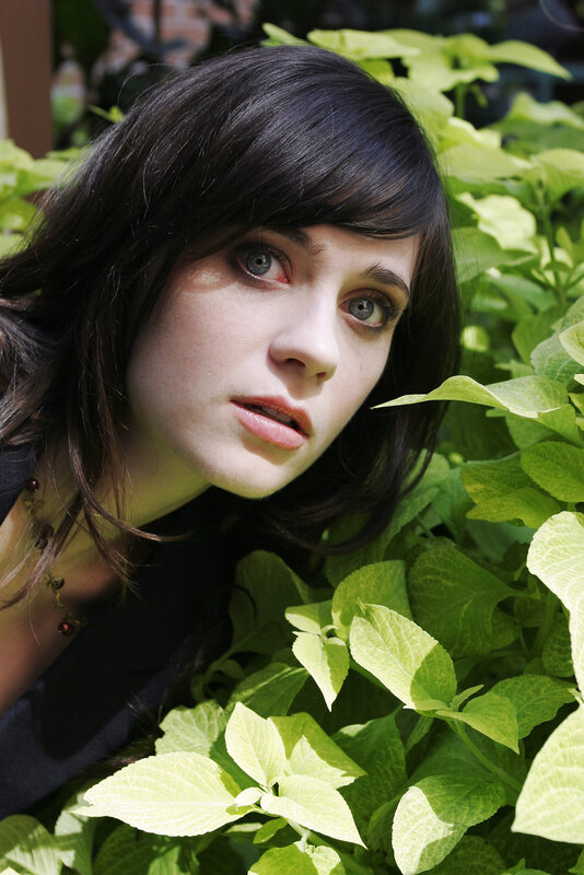 woman among green leaves
