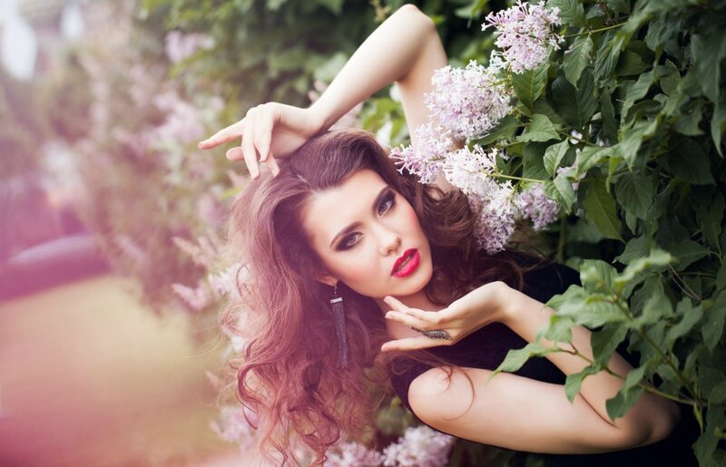 Woman Among Lilac Flowers — Purple, Dramatic