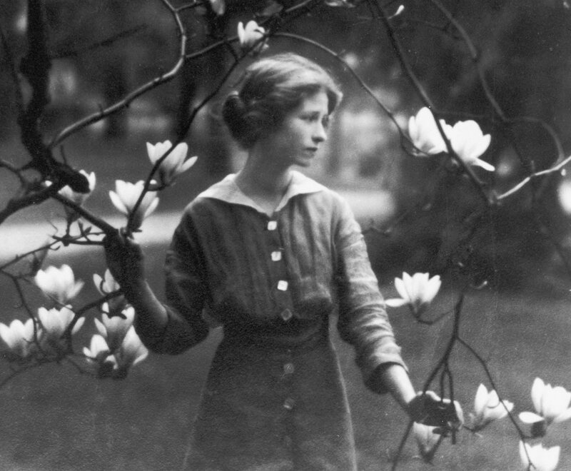 woman among magnolia blossoms