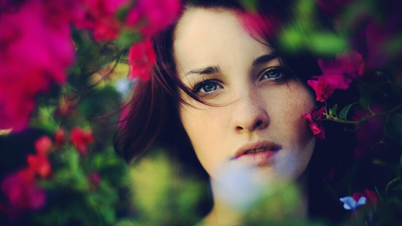 woman among pink flowers