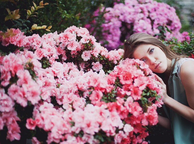woman among pink flowers
