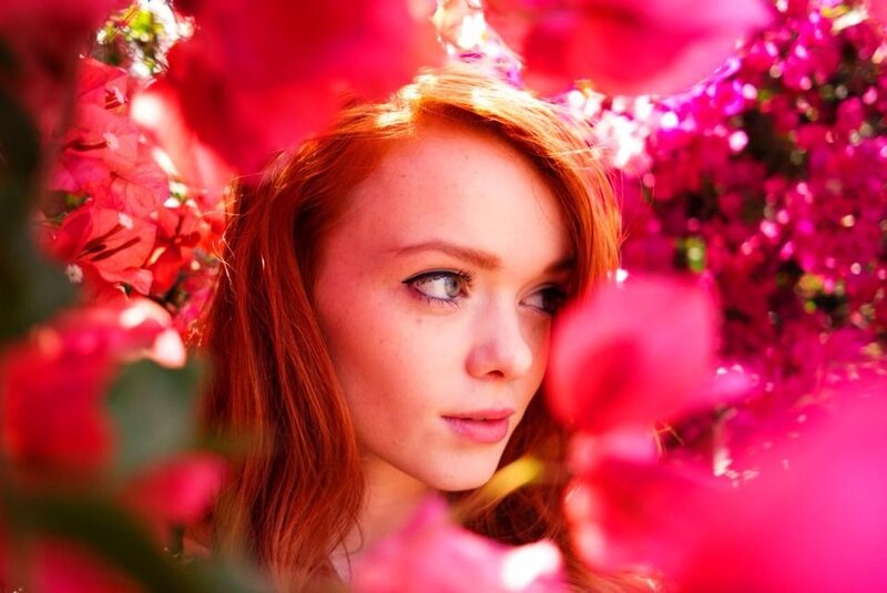 woman among pink flowers