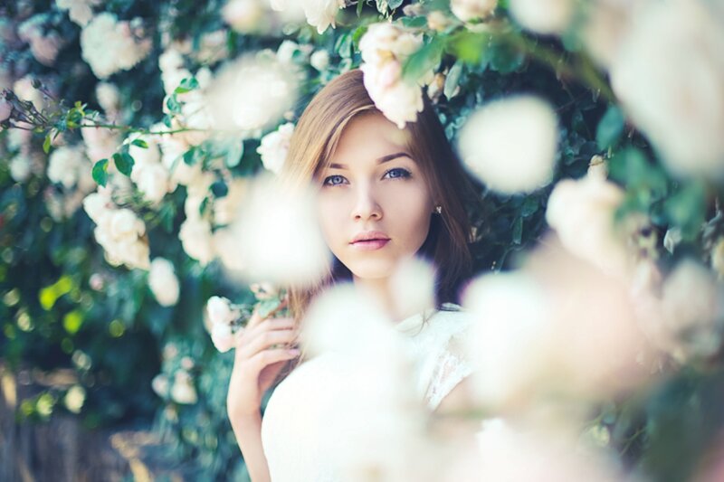 Woman Among White Roses