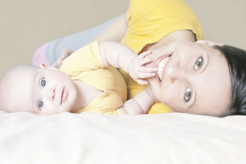 Woman and Baby Lying Down