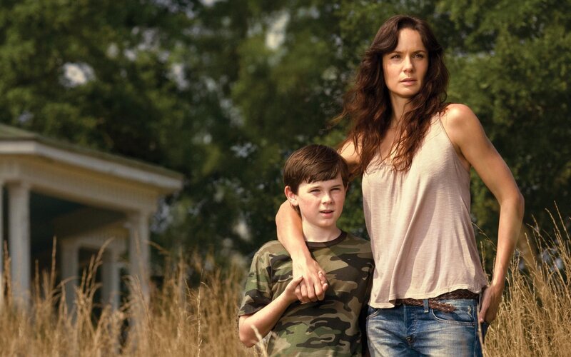 woman and boy in field