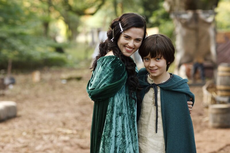 Woman and Boy in Green Cloaks