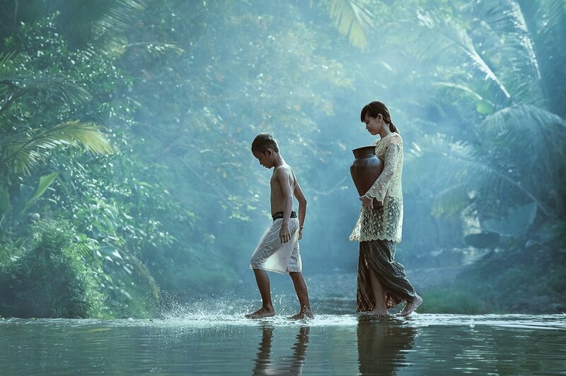 Woman and Boy in River