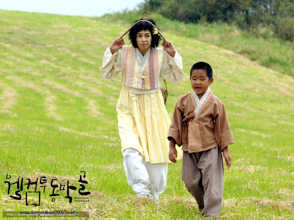 woman and boy in traditional clothing