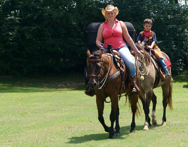 Woman and Boy on Horses