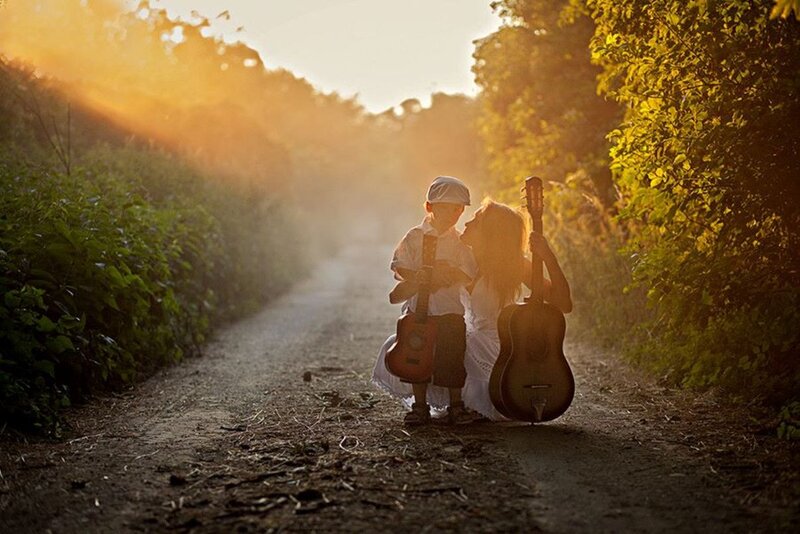 Woman and Boy with Guitars