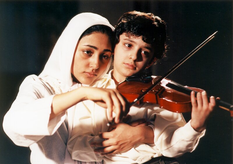 woman and boy with violin
