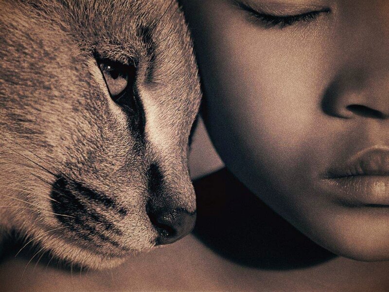woman and caracal close-up
