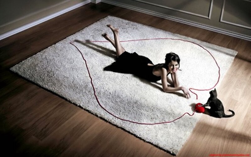 Woman and Cat on Rug
