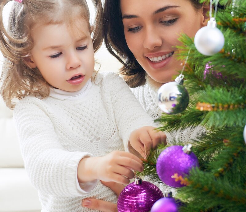 Woman and Child Decorating Tree