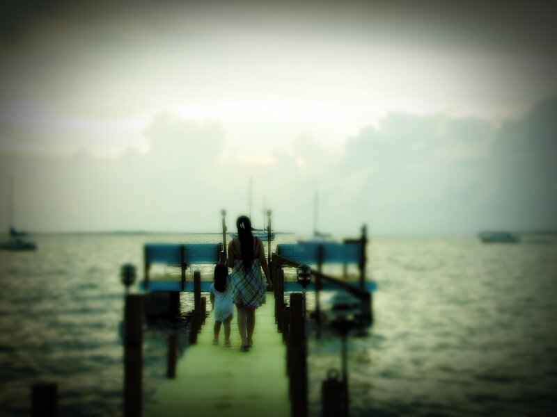 woman and child on a dock