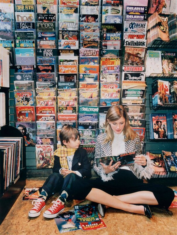 Woman and child reading comics