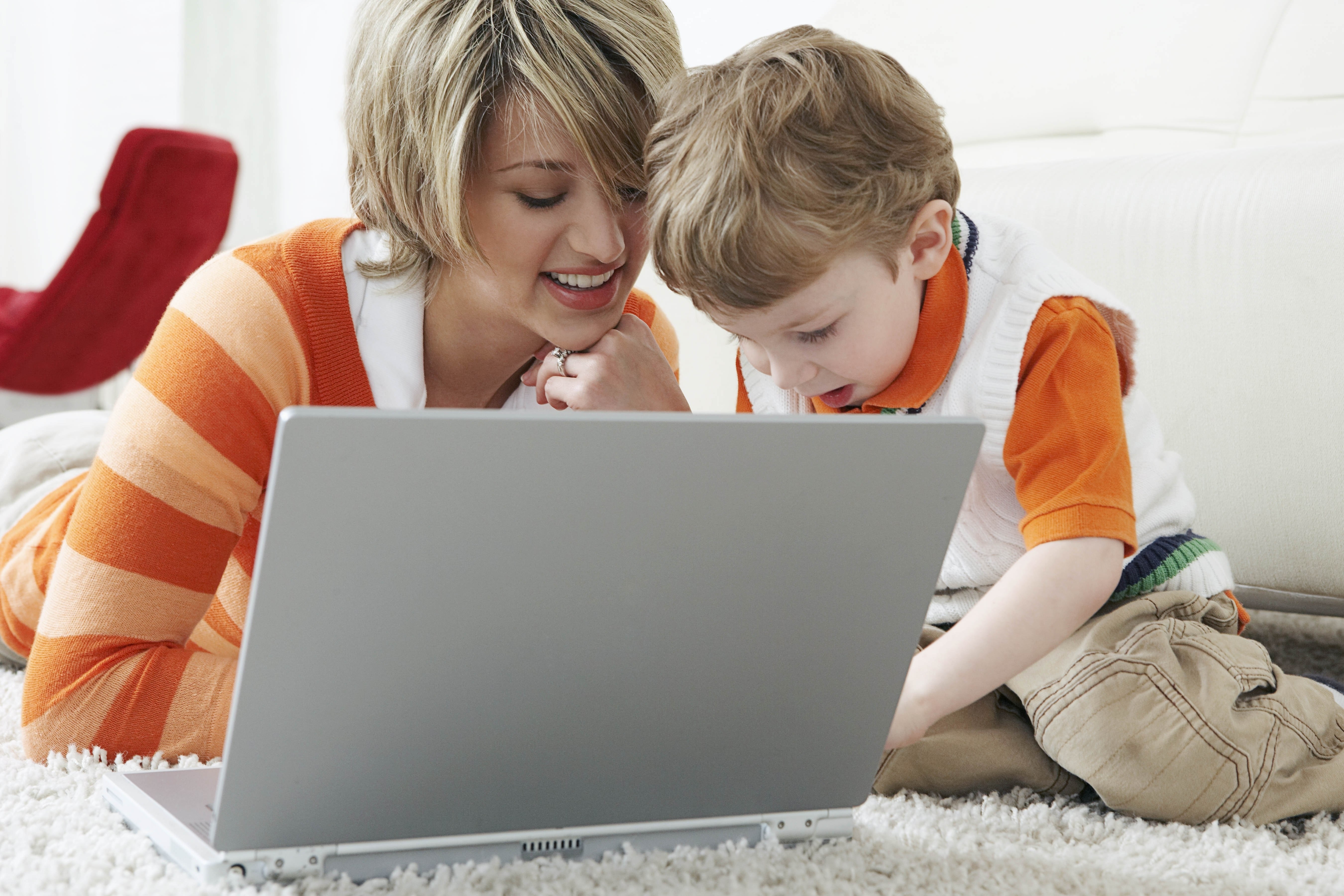 woman and child using laptop