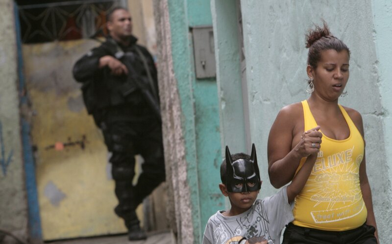 Woman and child with Batman mask