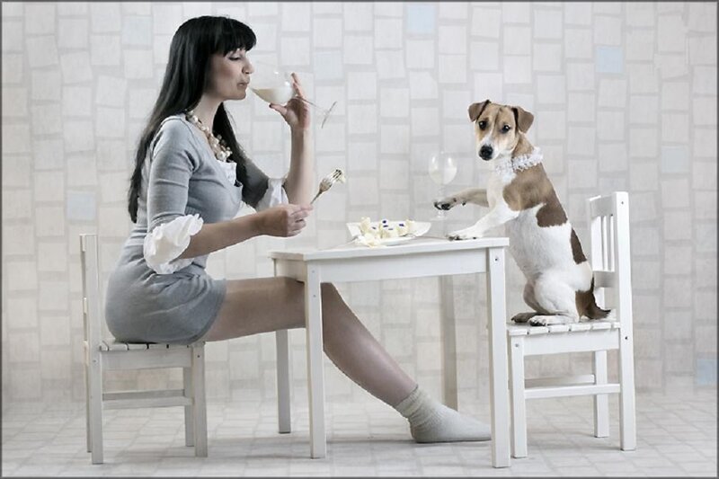 Woman and dog dining together