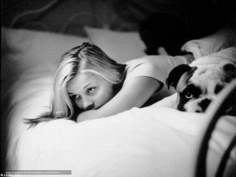woman and dog in bed