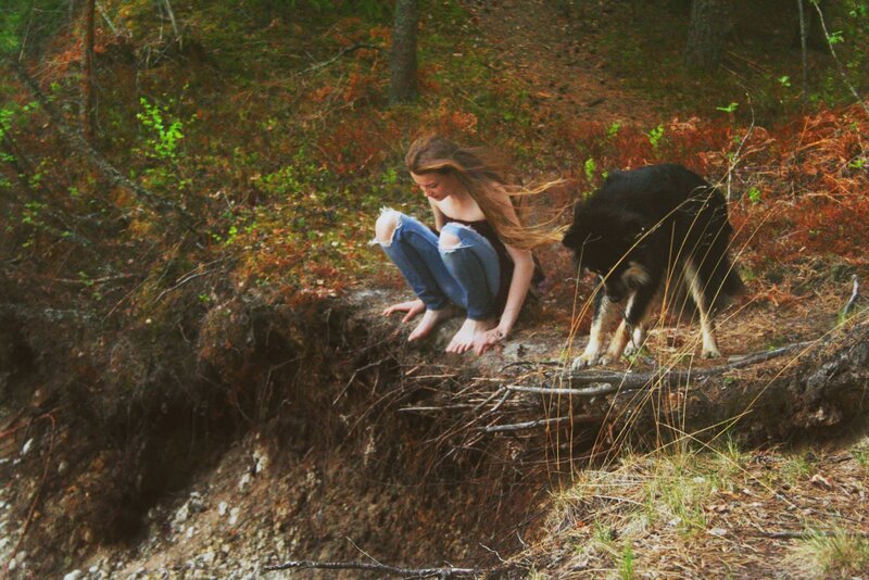 Woman and dog in forest