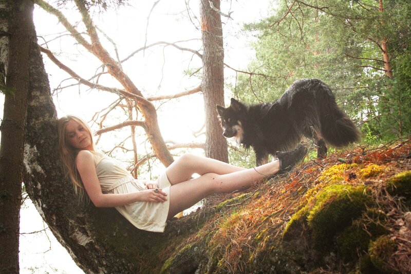 Woman and dog in forest