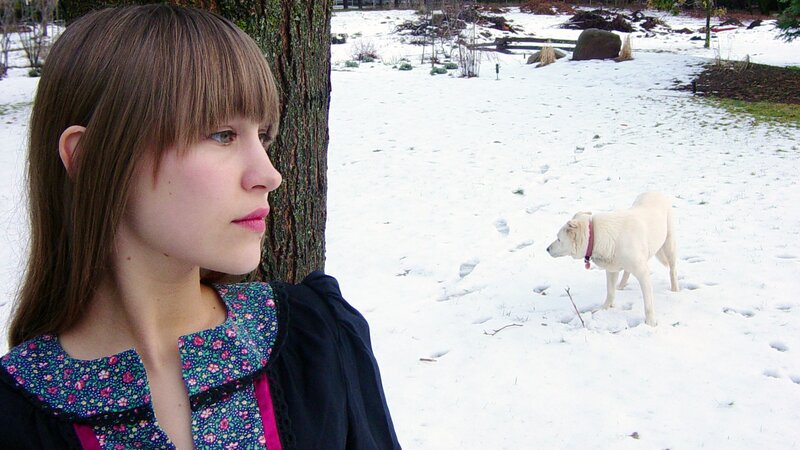 woman and dog in snow