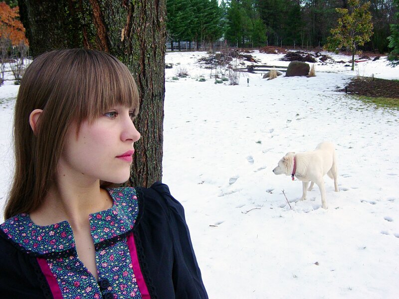Woman and dog in snow