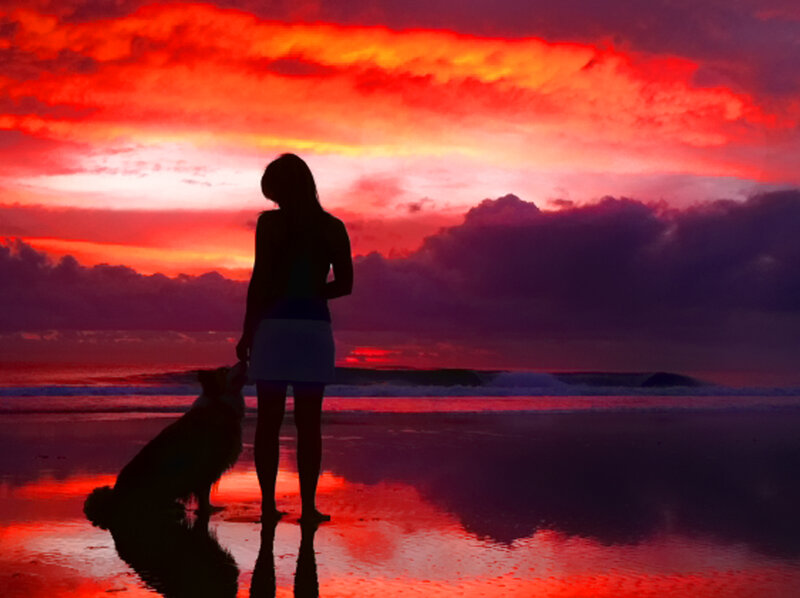 Woman and Dog on Beach — Red