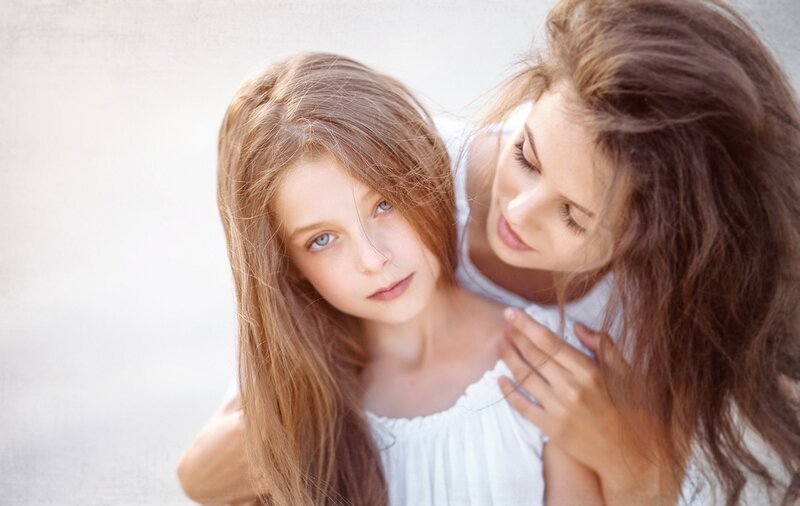 Woman and Girl Hugging — White