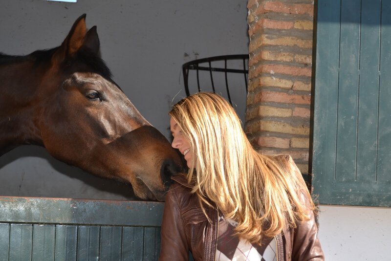 Woman and Horse in Stable