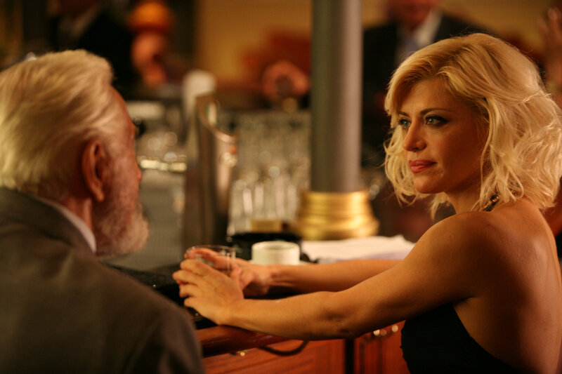 Woman and Man at Bar — Gold