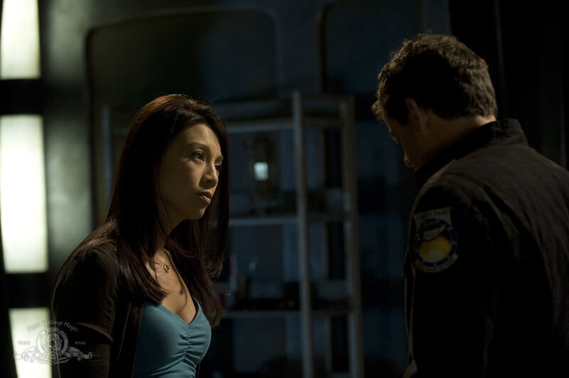 woman and man in dimly lit room