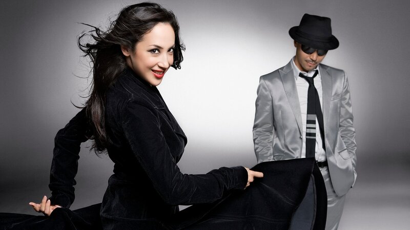 Woman and Man in Suits — Black, Dramatic