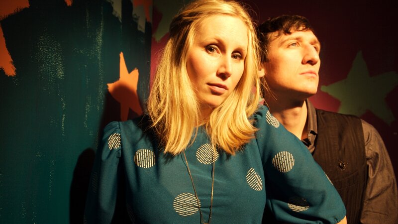 Woman and Man Standing — Teal