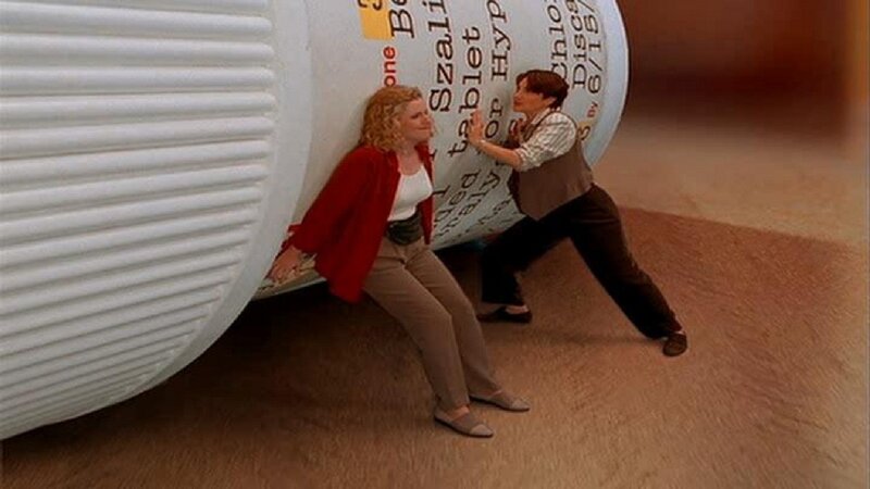 Woman and Man with Giant Pill